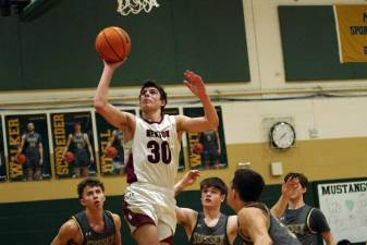 Newton's Maxwell Maslowski goes airborne during a game Feb. 3 against Sussex Tech. The Braves lost, 47-39. (Photos by George Leroy Hunter)