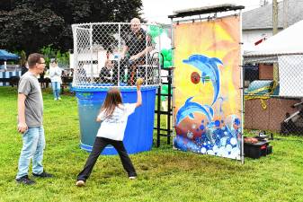 A child tries to dunk a police officer at Ogdensburg Day on Saturday, June 14. (Photos by Maria Kovic)