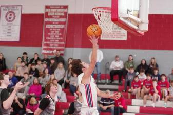 Lenape Valley's Anthony Kali goes high toward the hoop during a shot attempt Saturday, Dec. 16. He scored 14 points in the game at High Point. The Wildcats won, 43-40. (Photos by George Leroy Hunter)