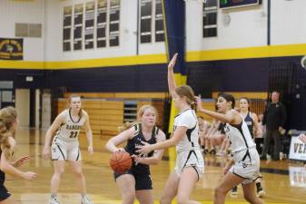 A Vernon player handles the ball as Wallkill Valley defends Feb. 10 in Vernon. The Vikings won, 62-49. (Photos by George Leroy Hunter)