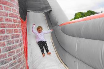 Karli loves the fire station bouncy house (Photo by Vera Olinski)