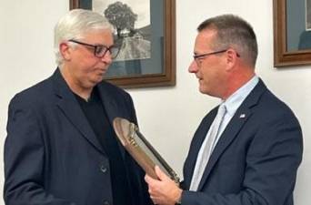 Hamburg Mayor Paul Marino, left, who has held that post for 22 years, receives a plaque from his successor, Richard Krasnomowitz, at the Dec. 5 meeting of the mayor and council. Marino did not run for re-election. Krasnomowitz will be sworn in at the annual reorganization meeting Jan. 4. (Photo provided)