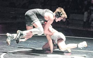 Wallkill Valley's Alekos Reinle goes airborne while wrestling Hackettstown's Adrian Pinto at 138 pounds. Pinto won by major decision (14-3).