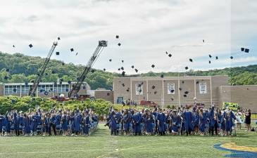 The Jefferson Township High School graduates toss their caps in the air at the end of the ceremony Friday, June 20. (Photos by Denise von Wilke)