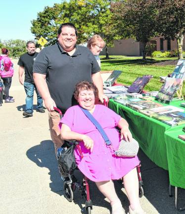 Brian and Mary Feuer of Hamburg pose in front of a table.