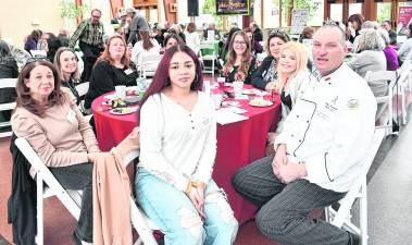 <b>Representatives from Manna House, Samaratin Inn, The Franklin Band and Scout Troop 150 pose for a photo.</b>