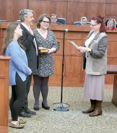 Stanley J. Kula, pictured with his family, takes the oath of office for Hardyston Township Mayor.