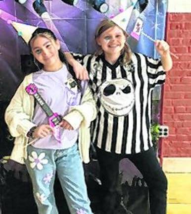 Madelyn Deleon and Abigail Nicolas enjoy the carnival.