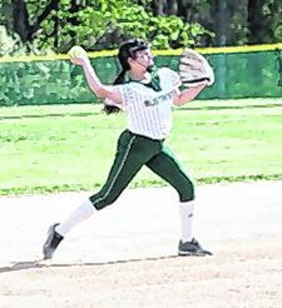 <b>Sussex Tech infielder Nevaeh Feliciano throws the ball towards first base during a play. Feliciano scored 1 run for her team.</b>