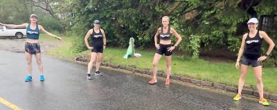 Suzanne LaBurt, Lauren Jackson, Laura DeLea, and Roberta Groner after winning the team masters division championship in a virtual mile.