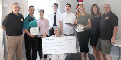 At last June’s Sparta VFW Ralph Rojas Scholarship ceremony (from left): Delores Rojas. Back: Stan Tryba, Tim Dean, Danielle Dean, Kyle McHugh, Ben Rogoff, Kaitlyn Benes, Jackie O'Donnell, Pete Litchfield. (Photo by Patricia R. Carley, Esq.)