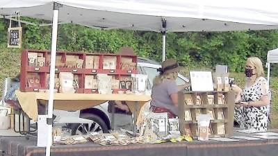 A scene from last year's farmers market in Vernon, which starts up again this Saturday (Photo by Janet Redyke)