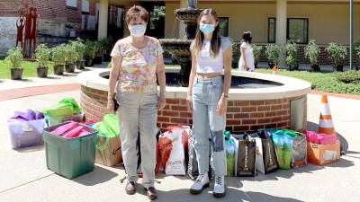 Ali Stoner (right) with her grandmother, Lois Pellow, and some of the supplies they gathered (Photo provided)