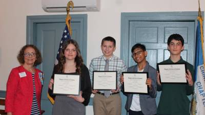 Allyn Perry. left, chairwoman of the Chinkchewunska Chapter of the DAR, poses with essay-contest winners, from left, sixth-grader Hannah Truesdell, eighth-grader Cameron Jones, fifth-grader Arjun Kabse and seventh-grader Carmine Scotto. (Photos provided)