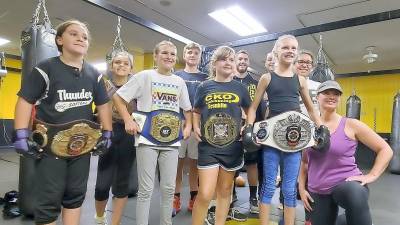 Some of the participants tried on Johnmichael’s belts that he has won