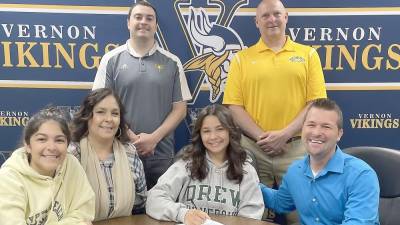 Emily Rhode signs with Drew University with her family and coaches by her side.