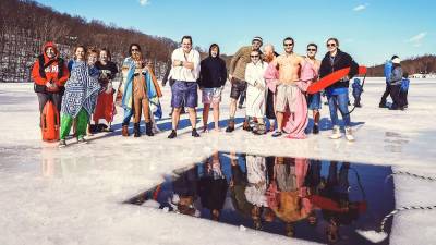 Lake Stockholm Polar Bear Plunge raises money for swim team and scholarship fund