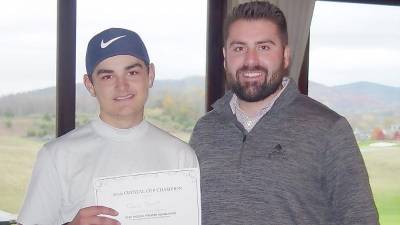 Dan Dessart,16, receives his Crystal Cup Men’s Champion prize from Crystal Springs’ Tyler Borkowski