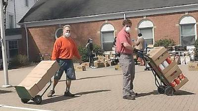 Volunteers with the Sparta Ecumenical Food Pantry distribute food (Photo provided)