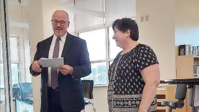 Hardyston Chief School Administrator Mike Ryder tells Holly Romahn that she won an Excellence Award.