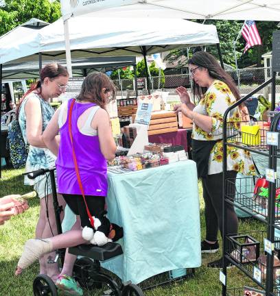 Visitors check out a booth at Ogdensburg.
