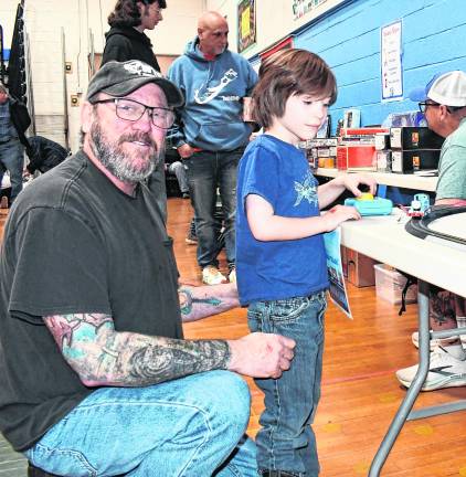 Tony Lander of Franklin looks at Thomas The Train while his grandfather, Laurence Lader of Sparta looks on.