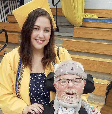 Alex Bisanzio at her high school graduation with her stepdad and inspiration, Joseph Duffy
