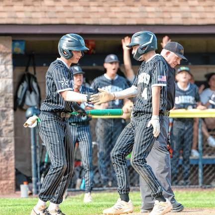Dylan Miller and Alex Opilla celebrate after Opilla scored and the Rangers took the lead, 2-1, from Pequannock.