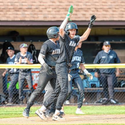 Dylan Miller celebrates after scoring a run in the top of the fifth inning against Pequannock.