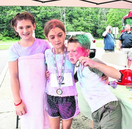 Brenna Maat, Savi and Parker Franek, all of Lafayette pose for a photo.