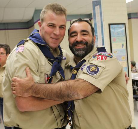 New Cubmaster Cliff Graham and Akela Carlos Soares are shown.