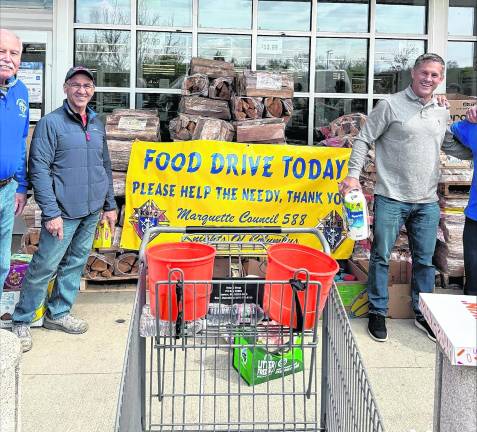 Members of the Knights of Columbus Council 588 collect food.