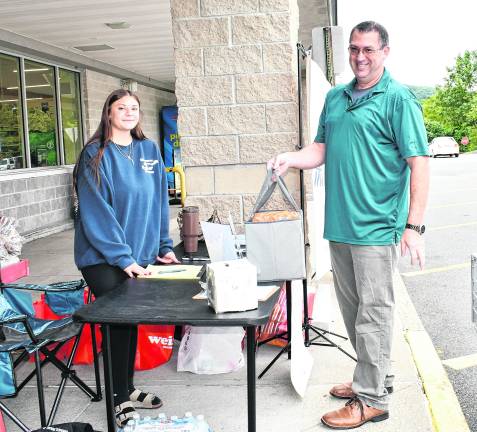 Joe Hendershot drops off a donation.