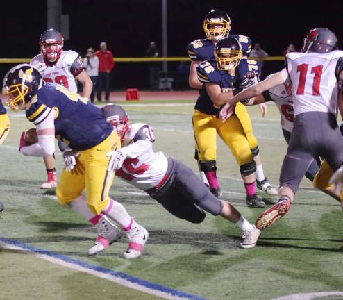 Vernon ball carrier Jeremy Kayhart is grabbed by High Point linebacker Ryan McCarrick (36) in the first half.