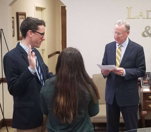 Ryan R. Laddey is sworn in by Thomas N. Ryan.