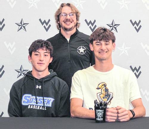 From left, Ryan Miller, Coach Connor Kopnik and Tyler Haberstroh pose for a photo.