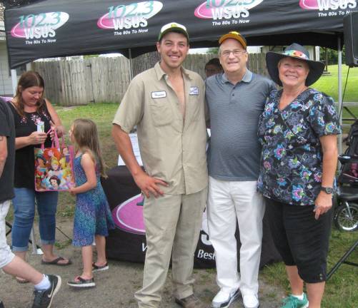 With all the activity and fun, (from left) Hunter Space, Steve Andrews of WSUS radio and Lori Space Day take a break and pose for a Junior Zookeeper Day photo.