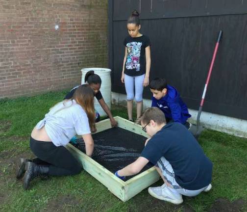 Middle-schoolers construct garden