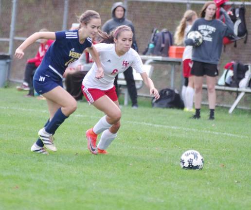 Vernon's Avery VanVugt and High Point's Jessenia Velez pursue the ball in the second period.