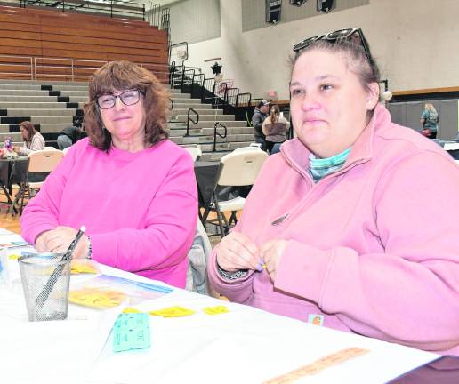 Debora Taylor of Ogdensburg and Kristyn Bresett of Wantage sit at a table.