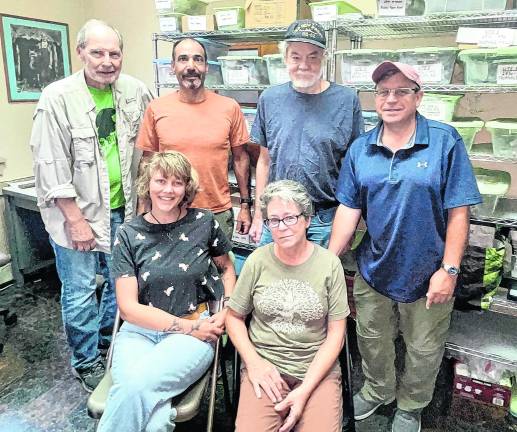 <b>The team reviewing the artifacts are standing: Jim Kotcho, Tony Lombardo, Bill Sandy and Everett Conklin; seated: Kalee McCloud and Karen Nelson.</b>