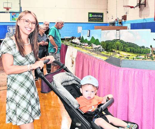 Marissa and Vinny Ricciardi of Fredon pose for a photo in front of a train display.