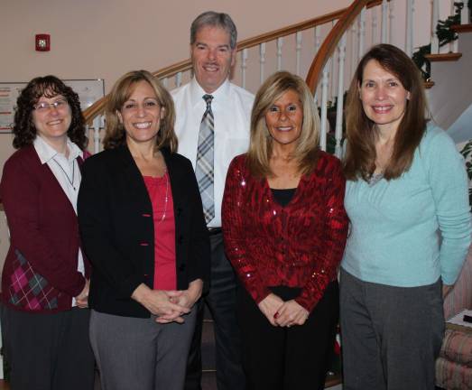 Lakeland Bank President &amp; chief exectuive officer Thomas Shara stands with Denise White, Lori Friedman, Doreen Musso and Michele Gilchrist, who were recently presented with an Employee of the Quarter award.