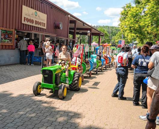 <b>The tractor parade through the fair Saturday, Aug. 2. (Photo by Nancy Madacsi)</b>