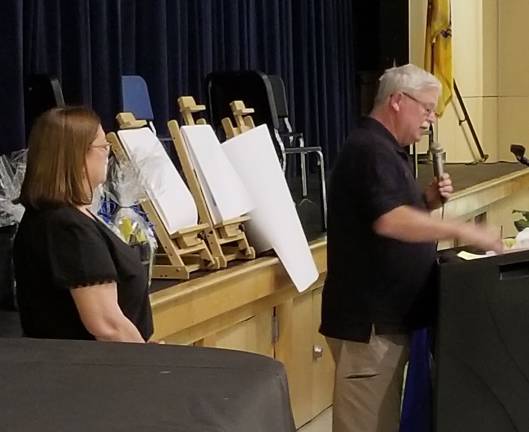 George Bremer of the Higlhand Lakes Fire Dept. speaks as Destiny Wynne looks on.