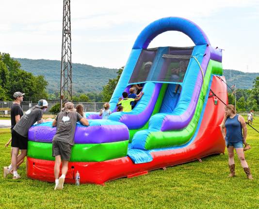 Children play on inflatables.