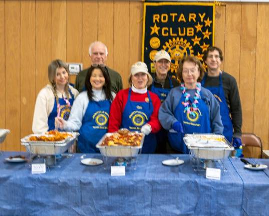 Members of the Branchville Rotary Clubs serve lunch at the event.