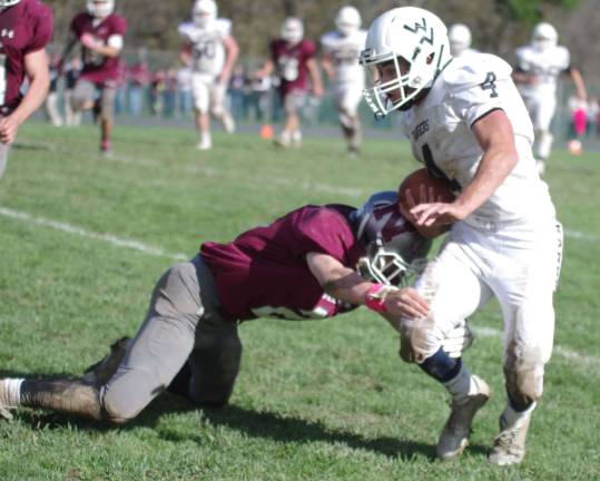 Wallkill Valley ball carrier Jake Lonsky is tackled by Newton defensive back Aaron Fantasia in the second half.