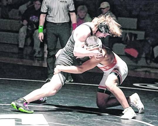 Wallkill Valley's Thomas Bradley (black) and Hackettstown's Diego Penaloza wrestle at 138 pounds. Penaloza won by technical fall (17-2) 4:54.