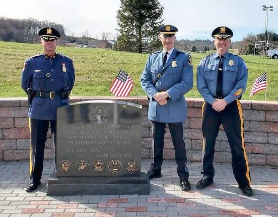 Hardyston Chief of Police Bret Alemy, USAF, Hopatcong Police Chief Robert Brennan, USMC, and Byram Police Chief Pete Zabita, USMC and US Army, stand along-side the Veteran’s Monument.